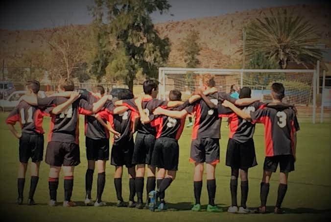 Gillen Scorpions players together on a football pitch